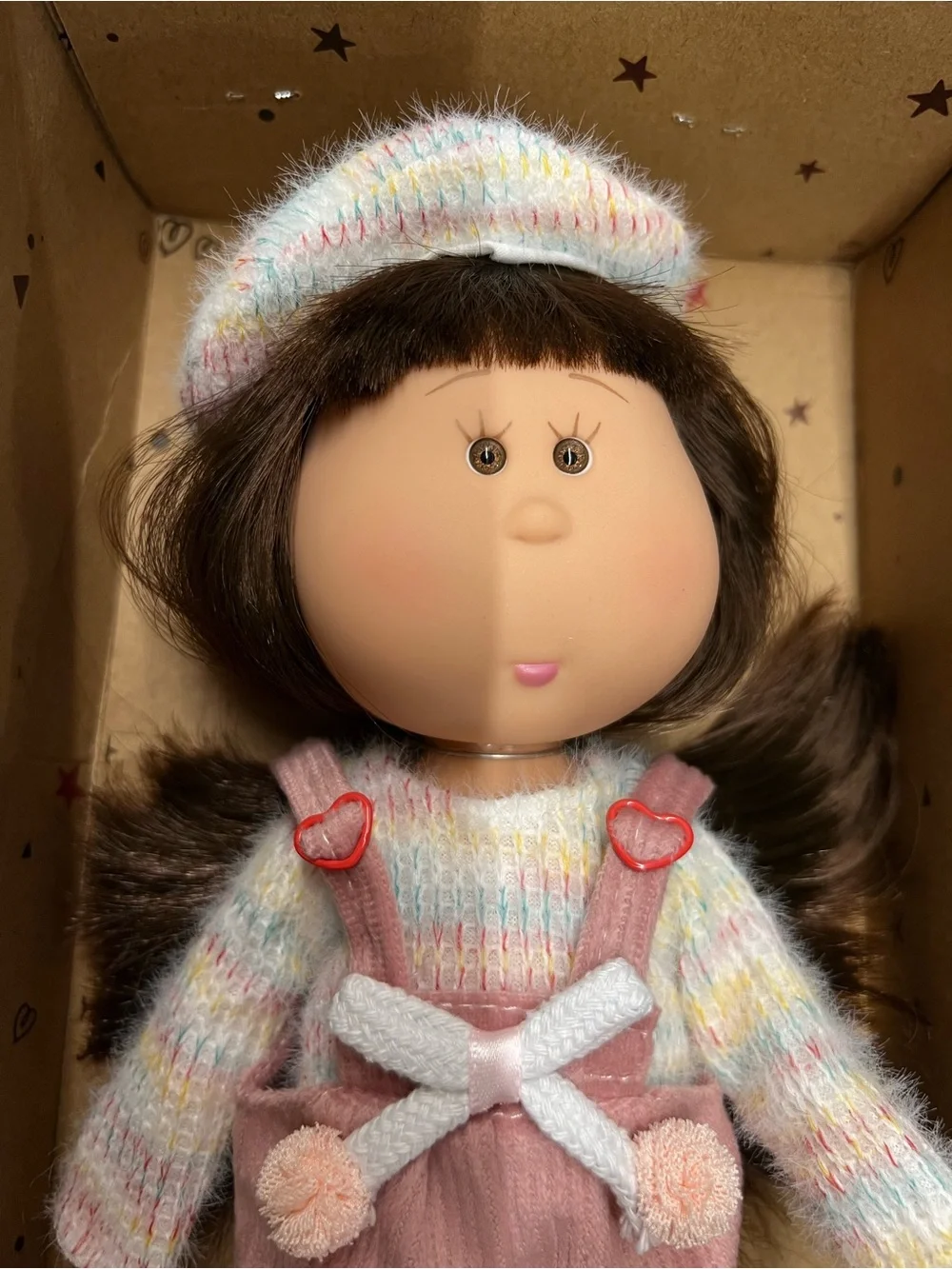New, Mia Doll with Brown Hair Wearing a Pastel Sweater and Pink Overalls.